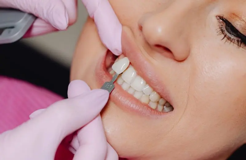 Dentist placing a dental implant at Recreate Smiles clinic in Joondalup